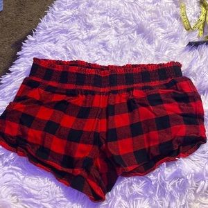 Worn Red and black pajama shorts